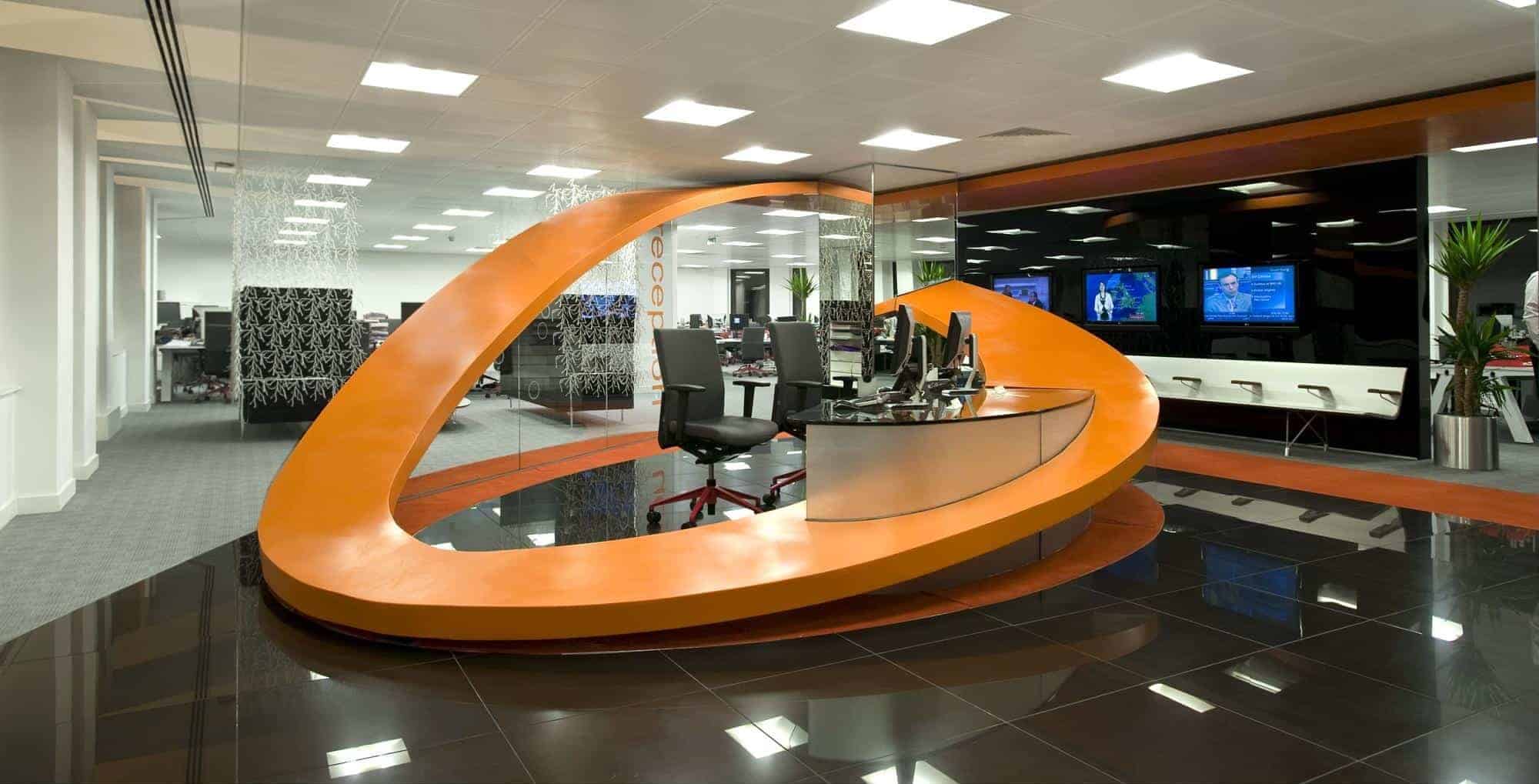 Orange reception desk made using Hi Macs Orange