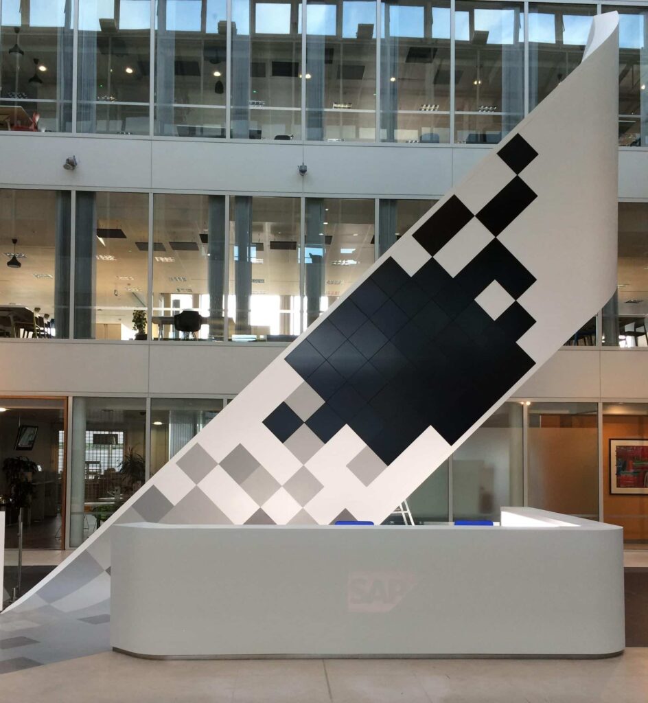 Swooping, curved reception desk and display from Solid Surface