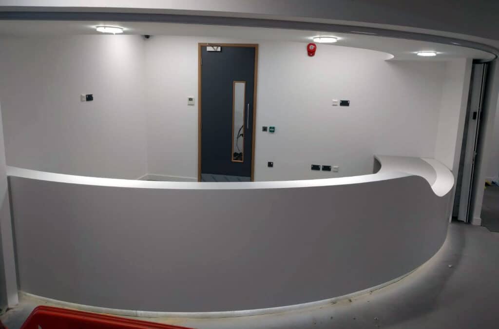 Curved medical reception desk in Solid Surface