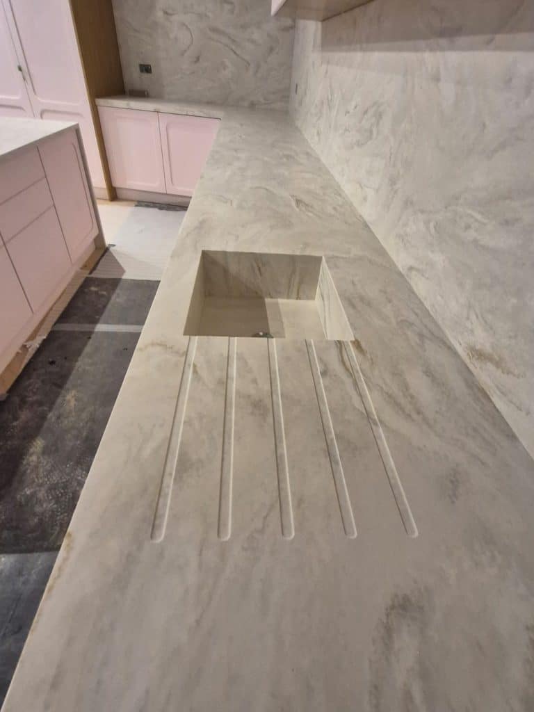 Veined Solid Surface kitchen unit with bespoke sink