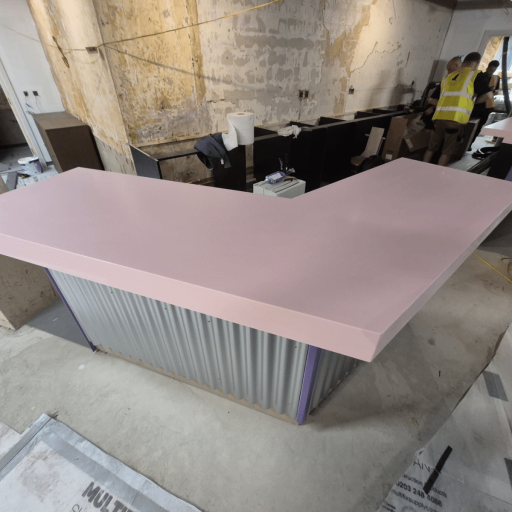 HIMACS Pink Leia bar top seamless Solid Surface worktop installation on commercial fit out project