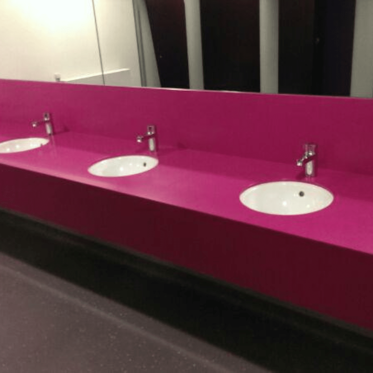 Pink Solid Surface vanity unit with integrated sinks